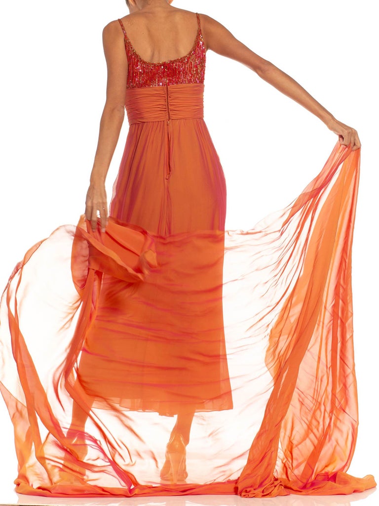 sex and the city 2 orange dress Carrie Bradshaw wears orange Valentino dress And Just Like That